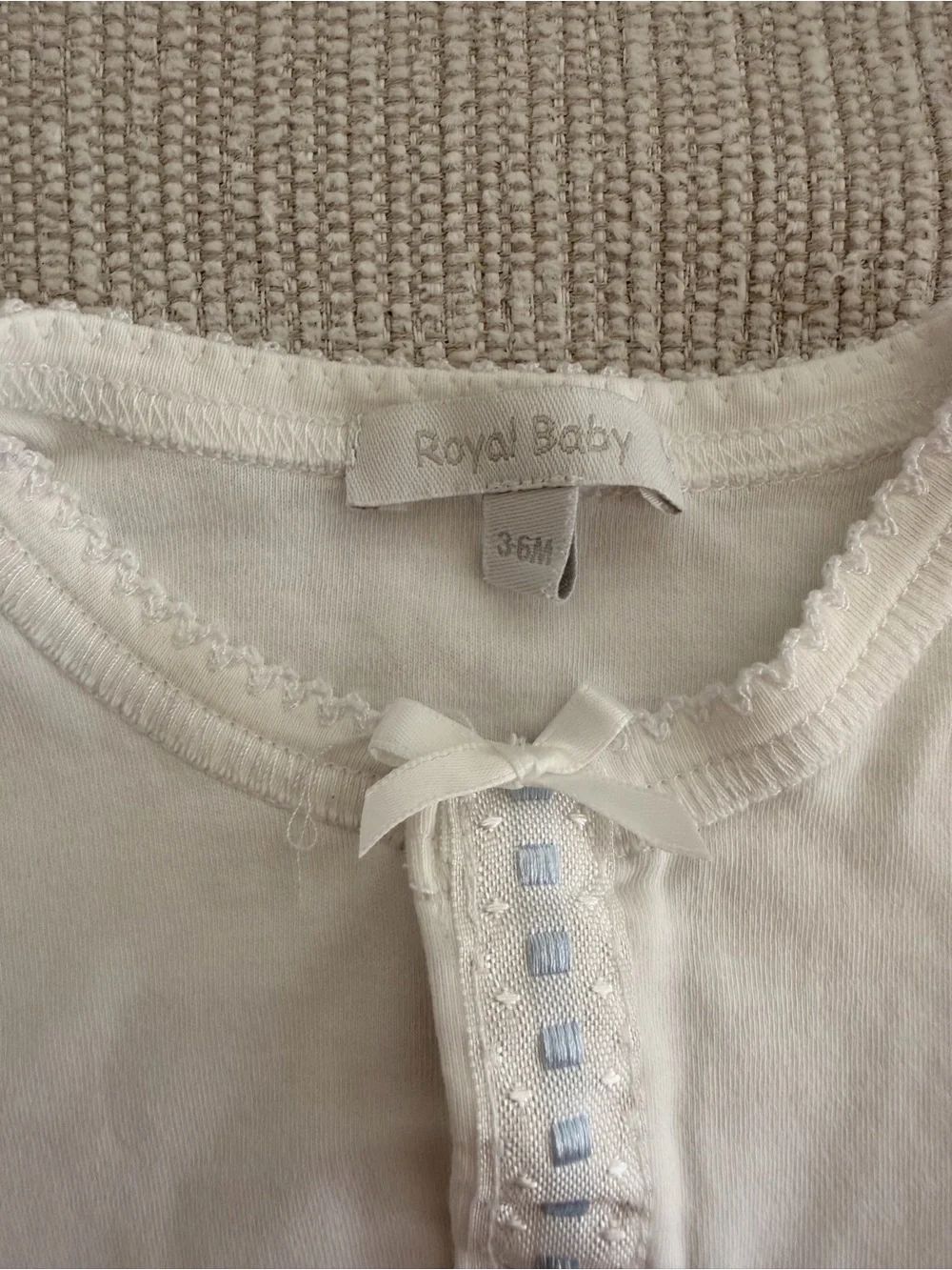 White Footless Baby Onsie with Blue Trim
